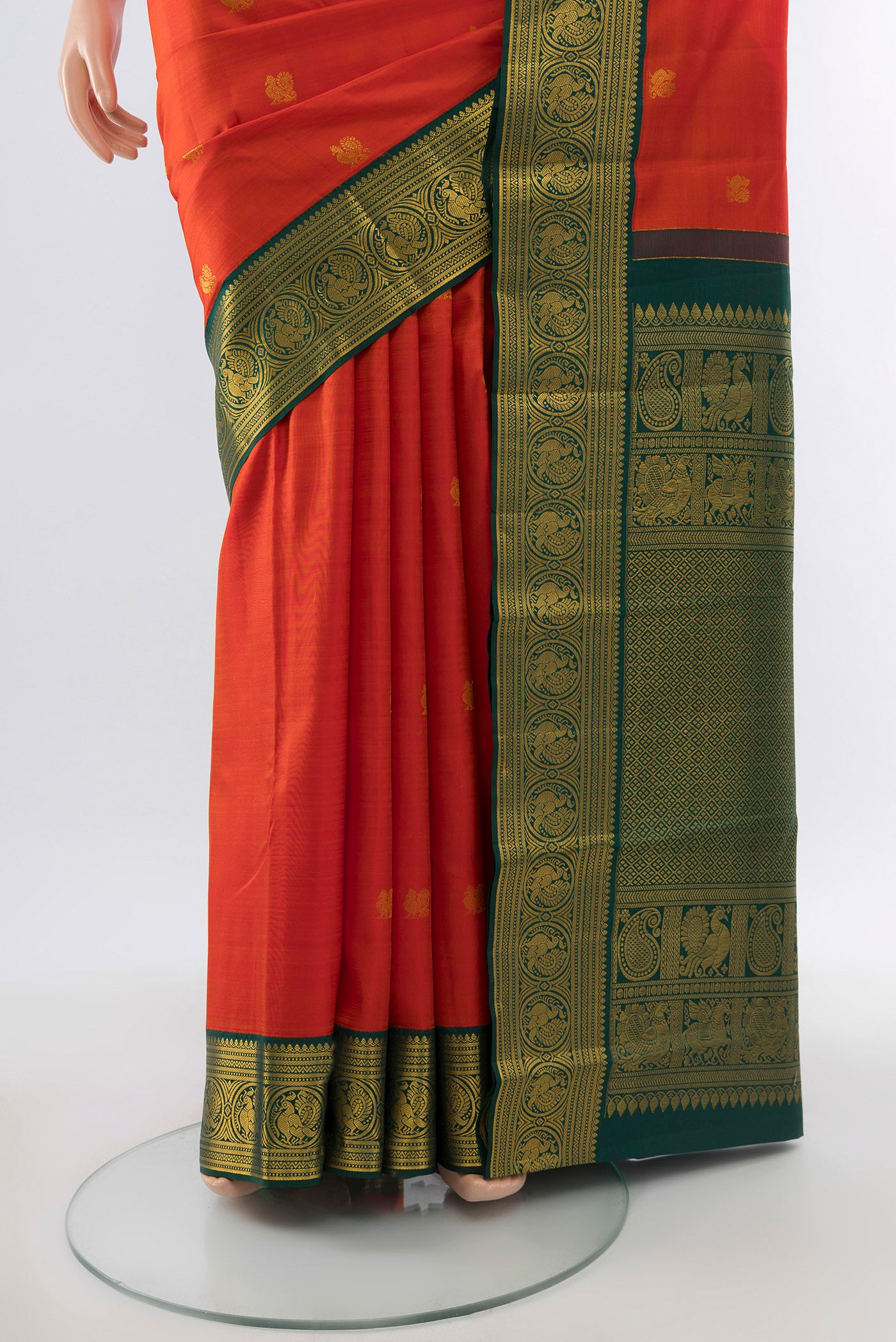 Pleats and pallu of Pure Silk Pure Zari Red Kanjivaram Saree with Zari Butta on the body and Silk Border. 