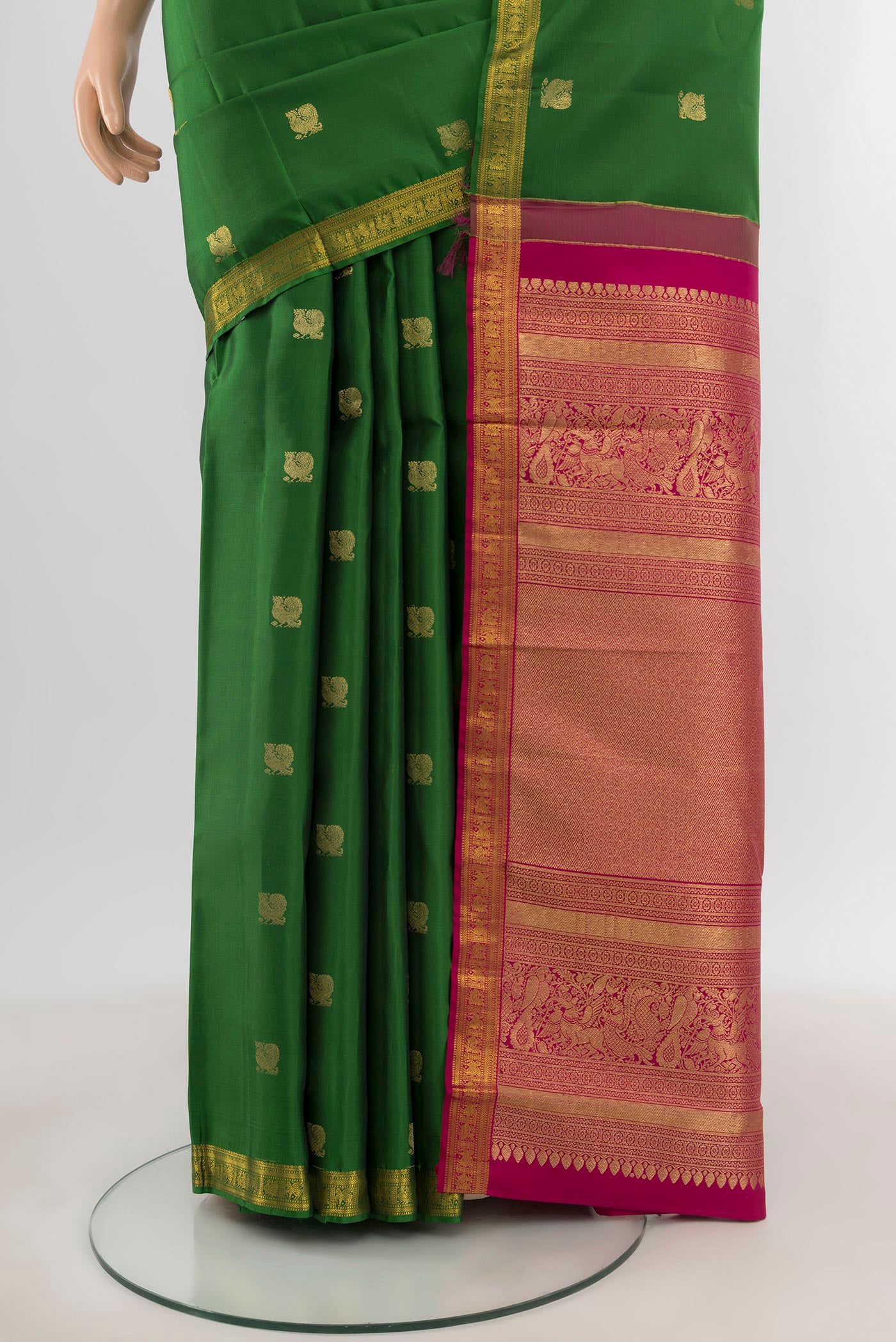 Pleats and pallu of Green Kanchipuram Silk Saree with Zari Butta on the body and Zari Border. 