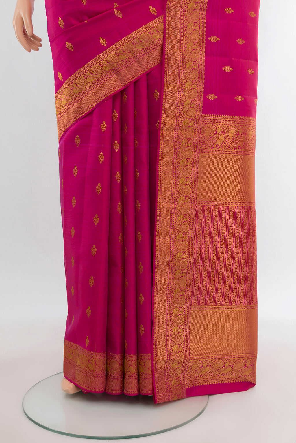 Pleats and pallu of Dark Pink Kanjivaram Silk Saree with Zari Butta on the body and Zari Border. 