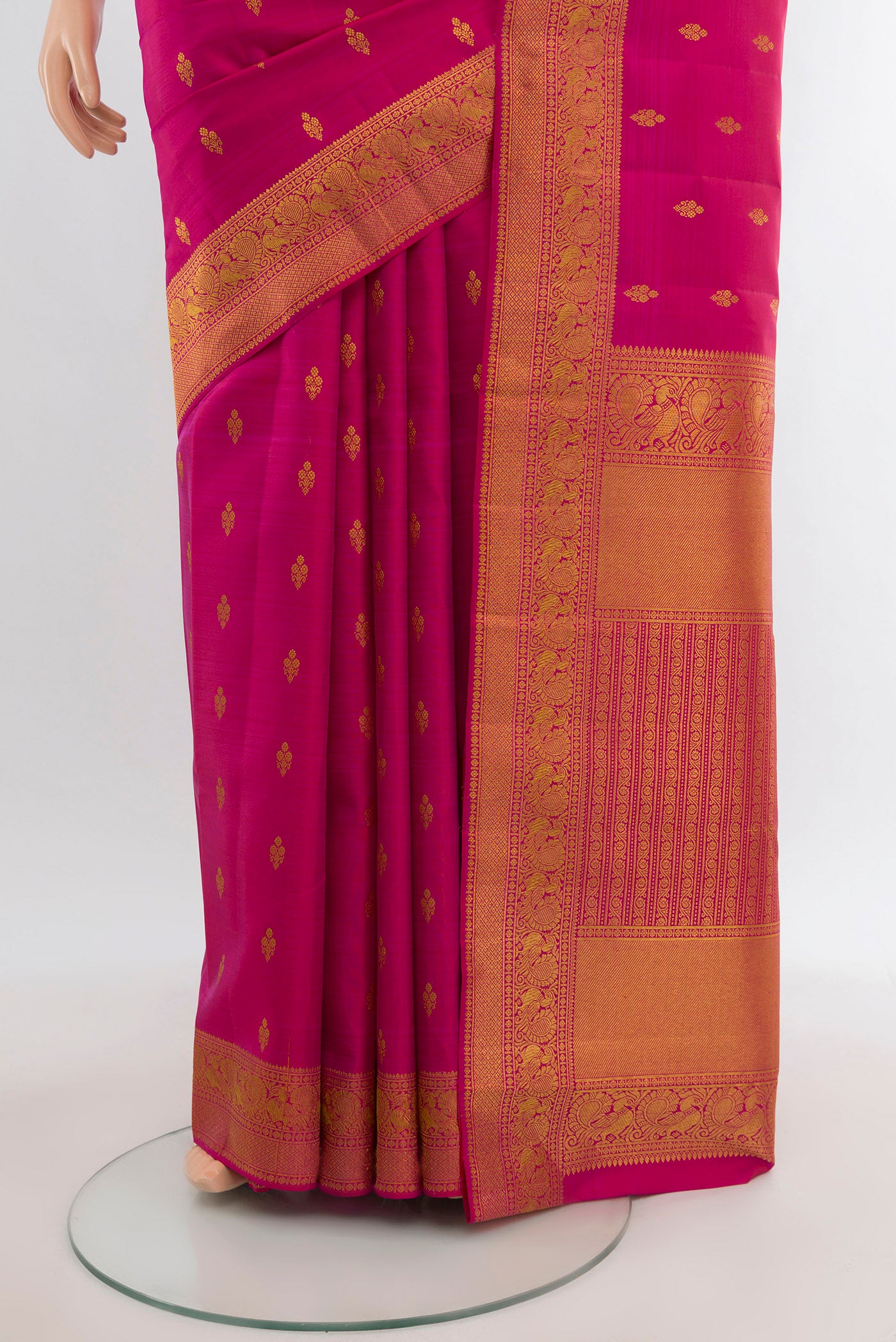 Pleats and pallu of Dark Pink Kanjivaram Silk Saree with Zari Butta on the body and Zari Border. 