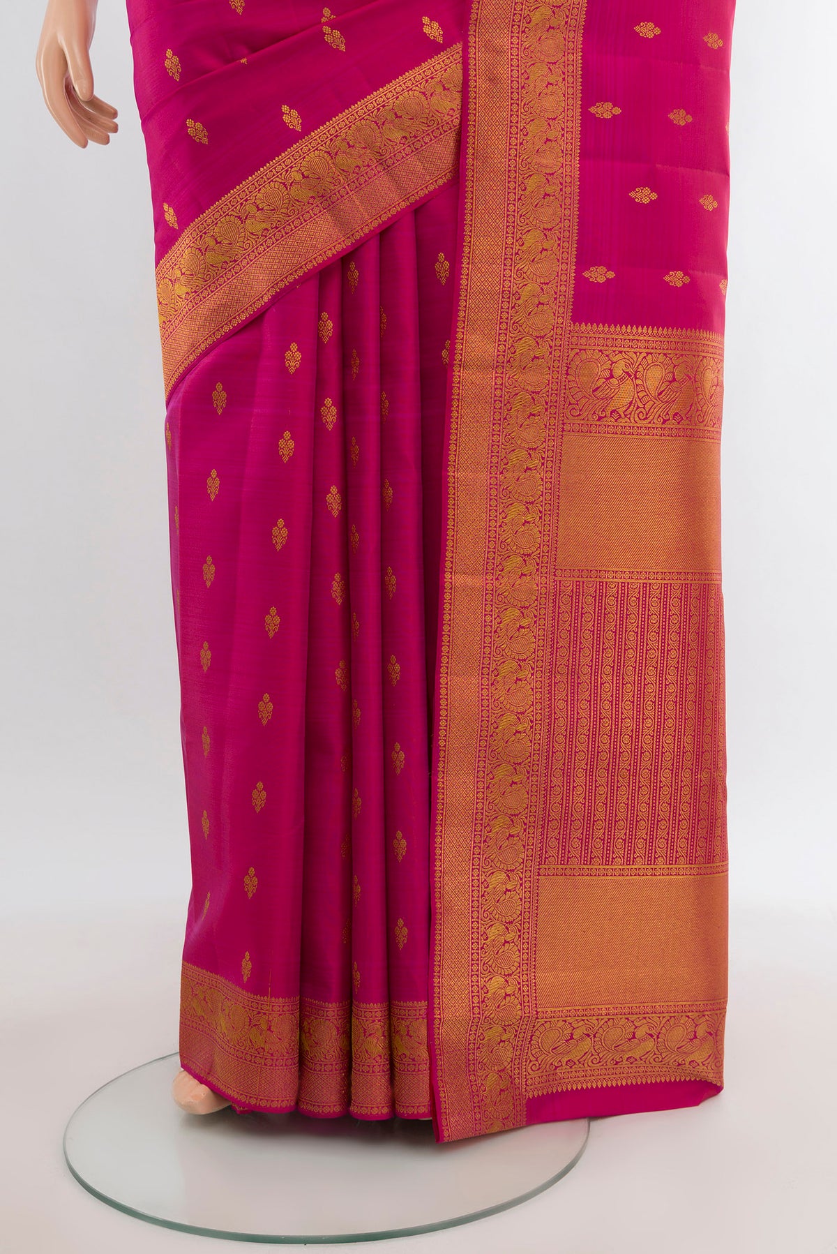 Pleats and pallu of Dark Pink Kanjivaram Silk Saree with Zari Butta on the body and Zari Border. 
