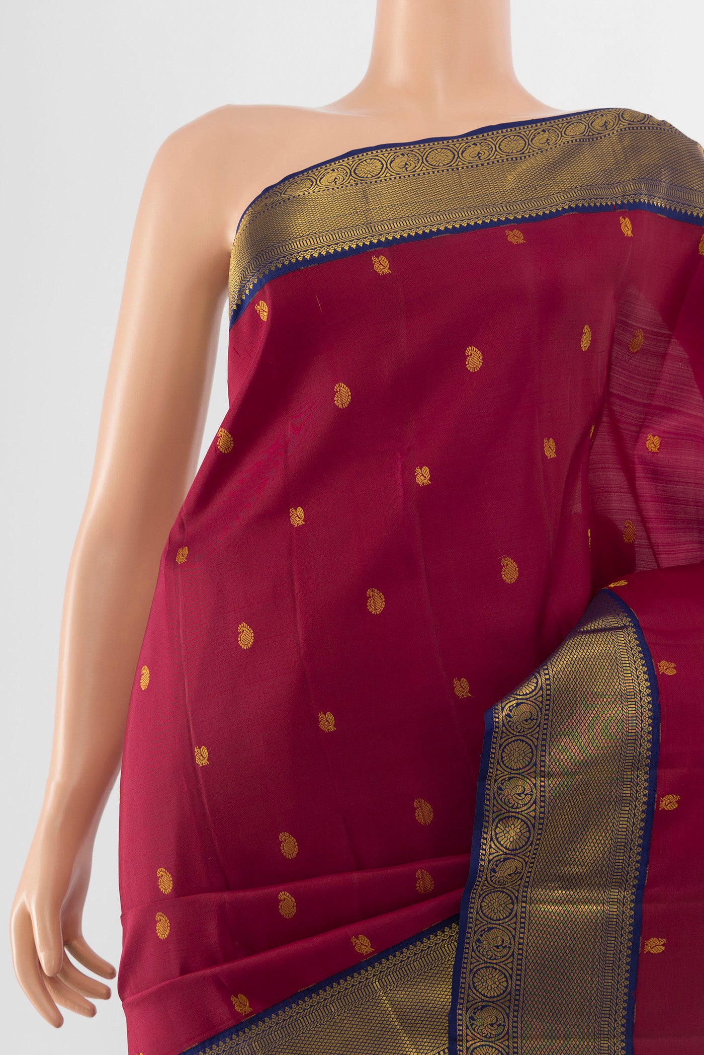 Border image of Pure Silk Pure Zari Maroon Kanjivaram Saree with Zari Butta on the body and Silk Border. 