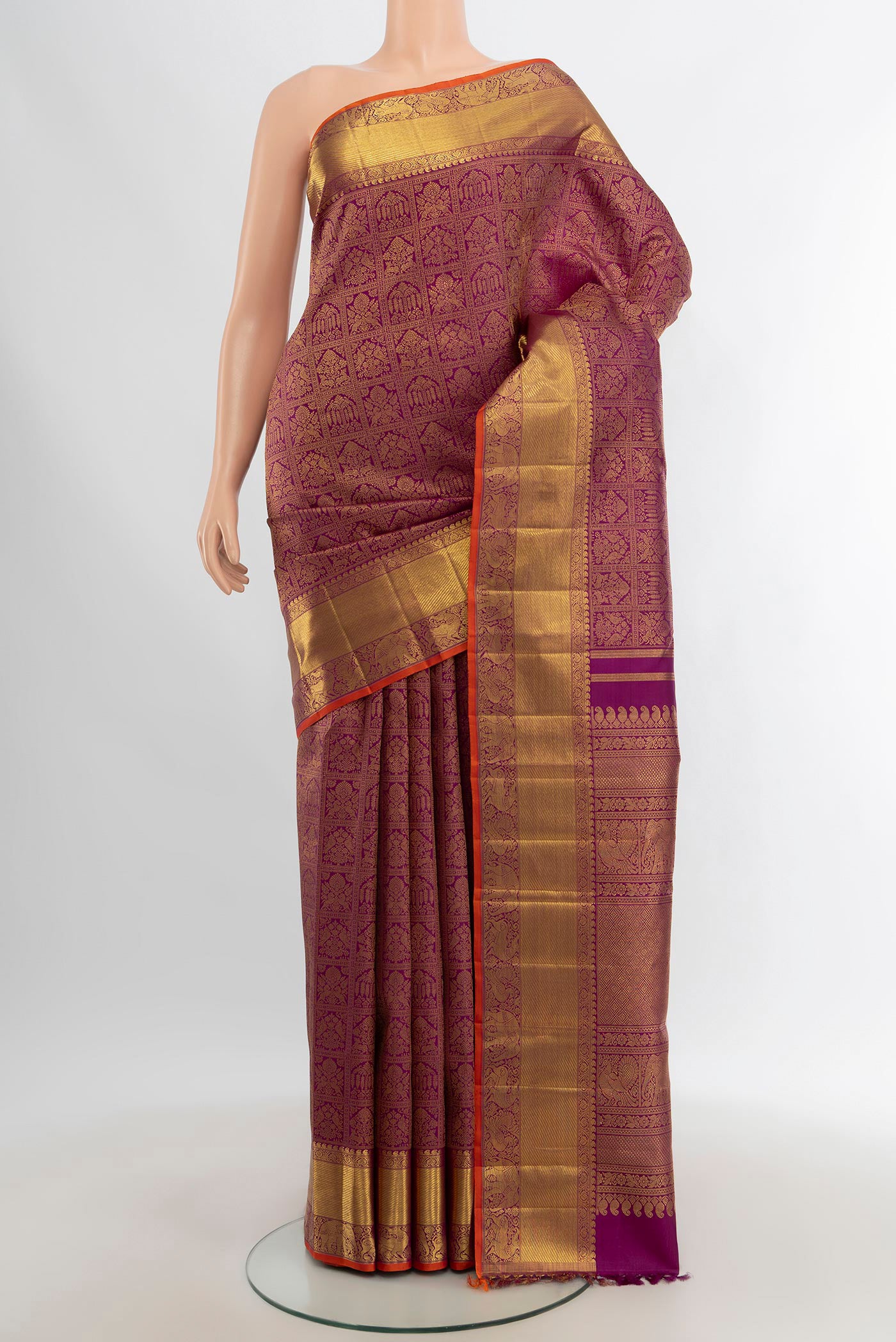 Pure Silk Pure Zari Purple Kanjivaram Saree with Zari Brocade on the body and Zari Border.  displayed on a mannequin
