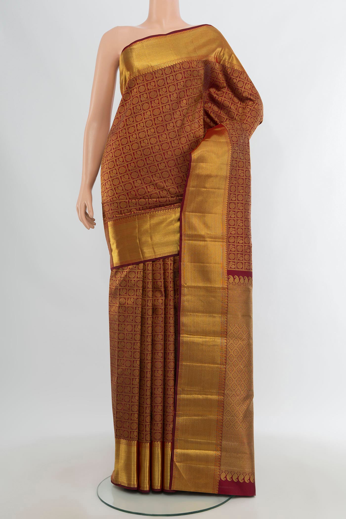 Pure Silk Pure Zari Maroon Kanjivaram Saree with Zari Brocade on the body and Zari Border.  displayed on a mannequin