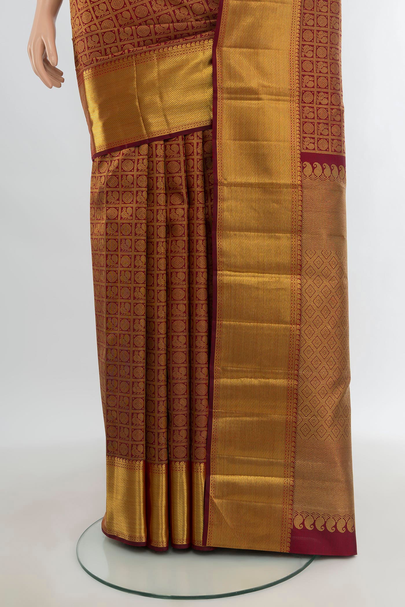 Pleats and pallu of Pure Silk Pure Zari Maroon Kanjivaram Saree with Zari Brocade on the body and Zari Border. 