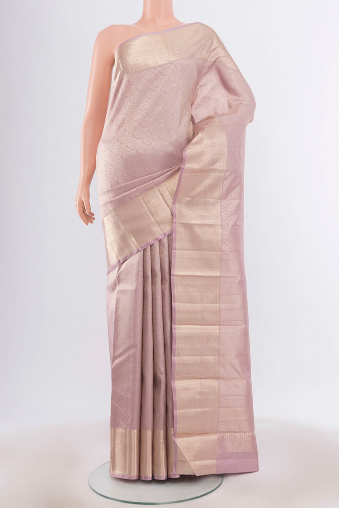Pure Silk Pure Zari Lavender Kanjivaram Saree with Zari Butta on the body and Silk Border.  displayed on a mannequin