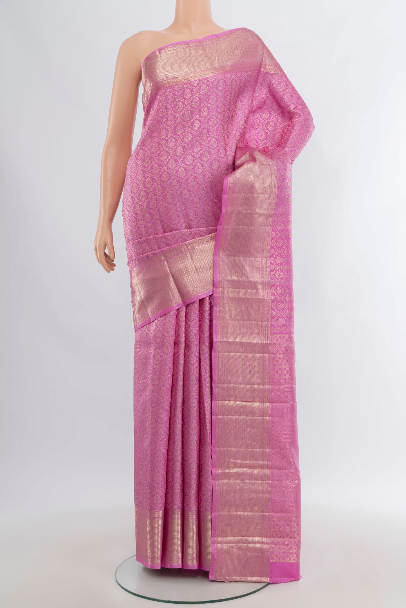 Rose pink Kanjivaram Silk Saree with Zari Brocade on the body and Zari Border.  displayed on a mannequin