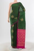Bottle Green Soft Silk Saree with Zari Brocade on the body and Silk Border.  displayed on a mannequin