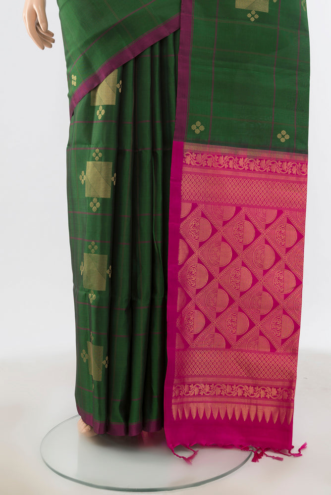 Pleats and pallu of Bottle Green Soft Silk Saree with Zari Brocade on the body and Silk Border. 