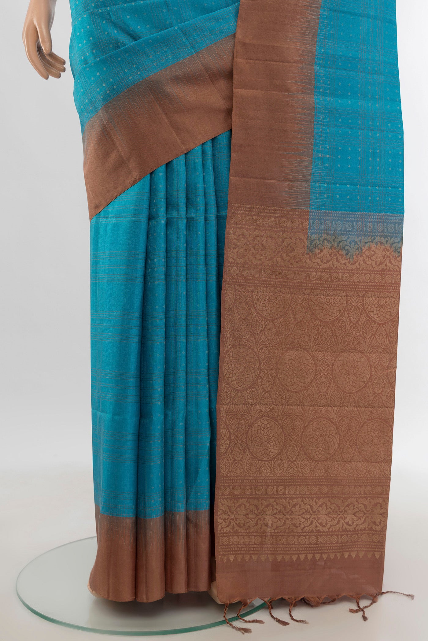 Pleats and pallu of Light Blue Soft Silk Saree with Zari Butta on the body and Plain Border. 