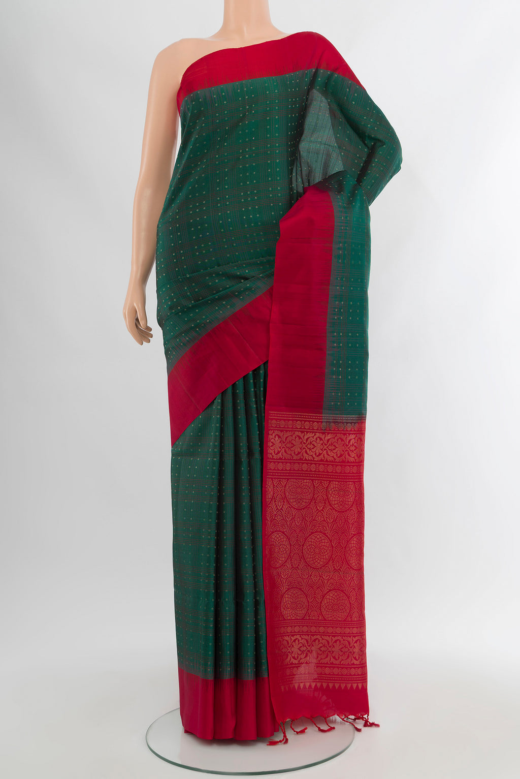 Peacock Blue Soft Silk Saree with Zari Butta on the body and Silk Border.  displayed on a mannequin
