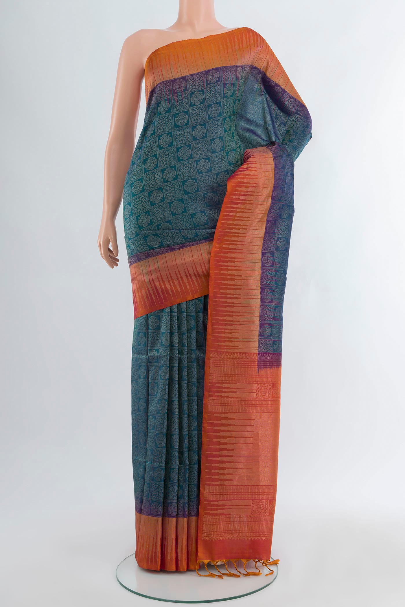 Peacock Blue Soft Silk Saree with Zari Brocade on the body and Zari Border.  displayed on a mannequin