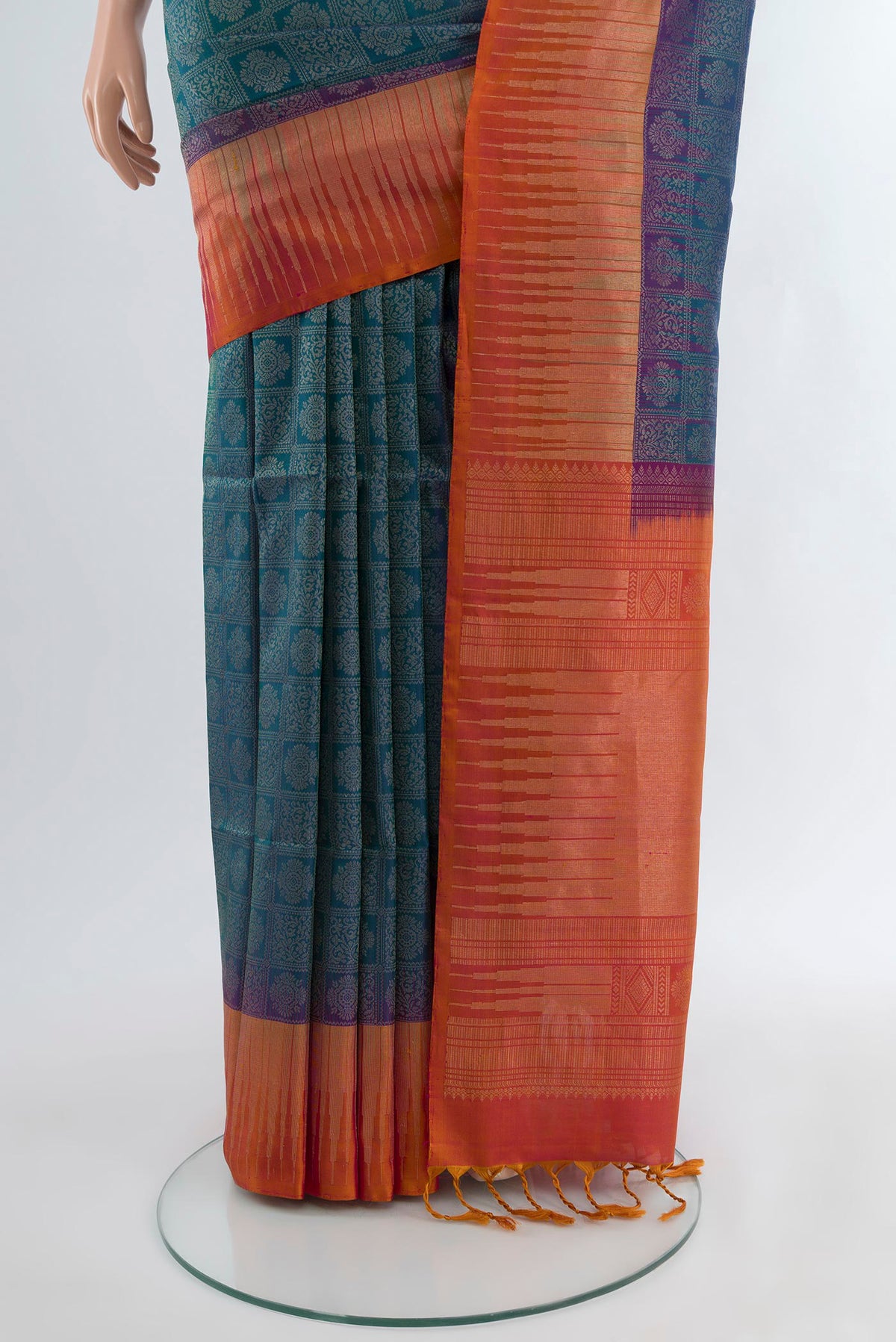 Pleats and pallu of Peacock Blue Soft Silk Saree with Zari Brocade on the body and Zari Border. 
