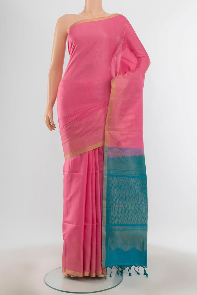 Pure Silk Pure Zari Rose pink Soft Saree with Zari Butta on the body and Silk Border.  displayed on a mannequin