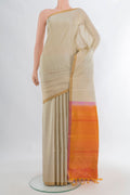 Pure Silk Beige Soft Saree with Zari Butta on the body and Zari Border.  displayed on a mannequin