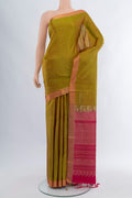 Mehandi Green Soft Silk Saree with Zari Butta on the body and Zari Border.  displayed on a mannequin