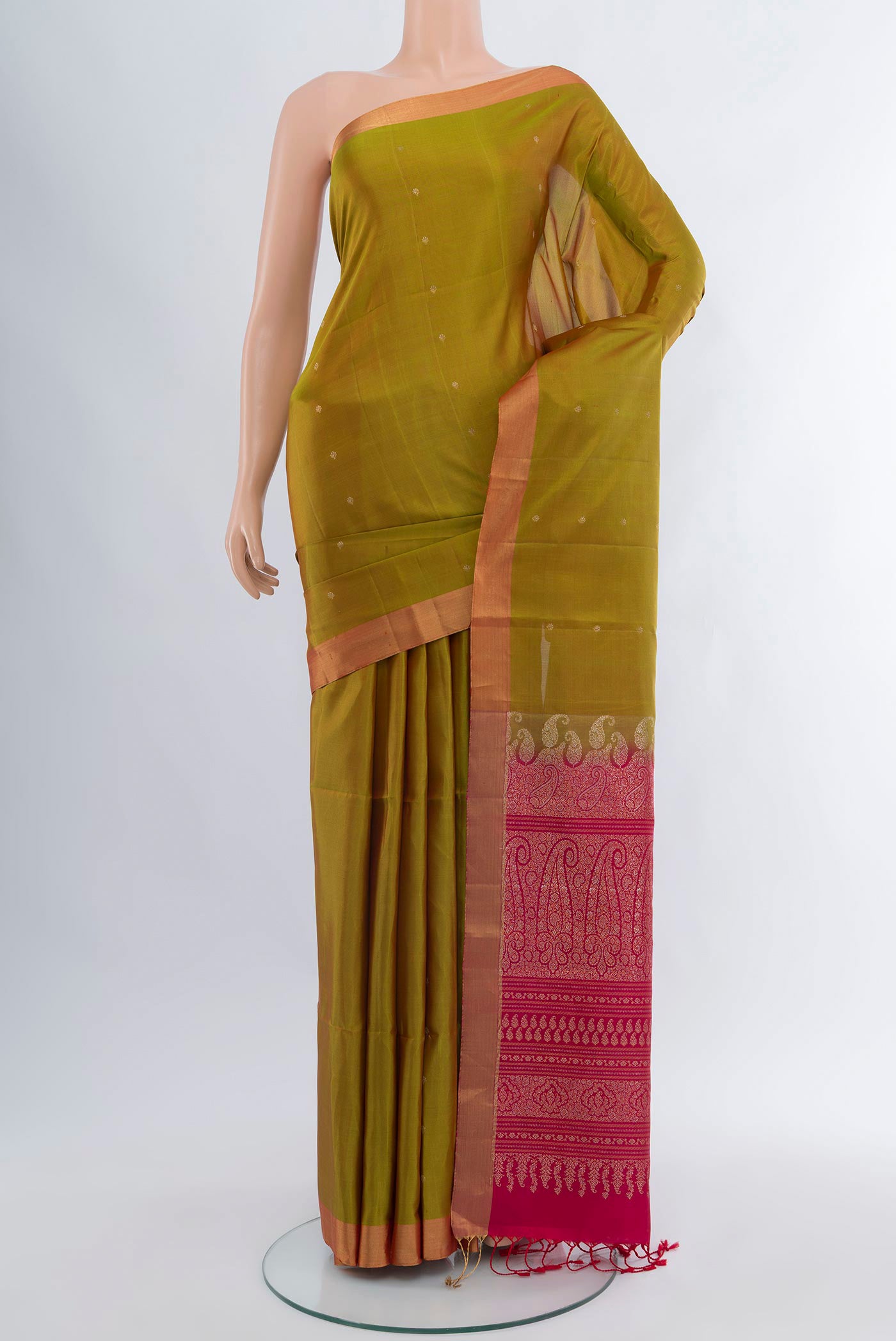 Mehandi Green Soft Silk Saree with Zari Butta on the body and Zari Border.  displayed on a mannequin