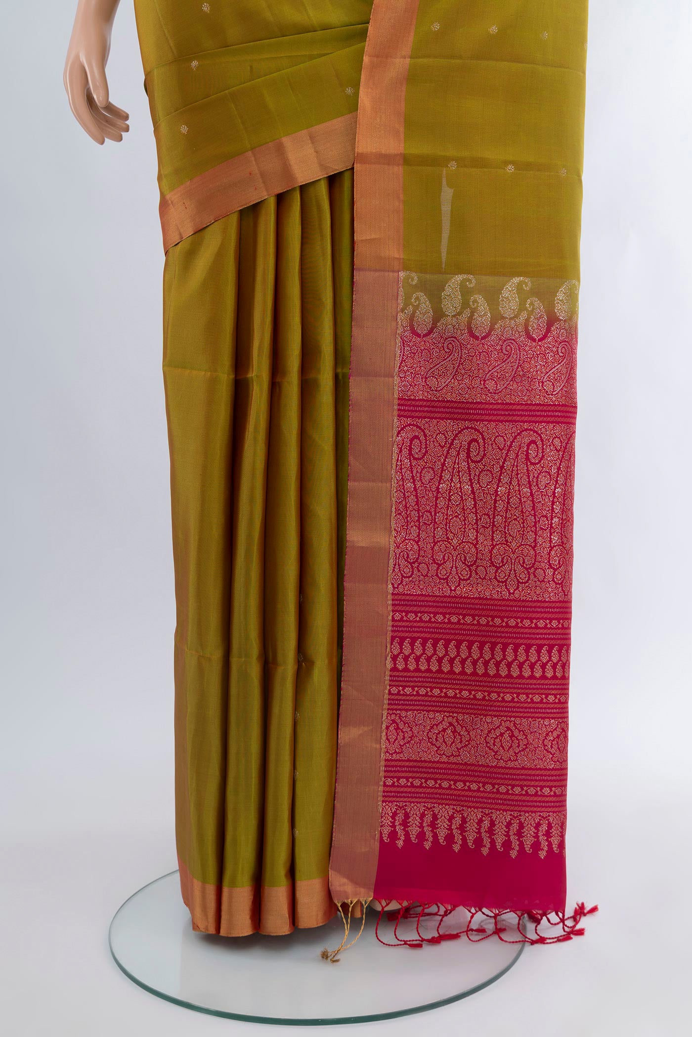 Pleats and pallu of Mehandi Green Soft Silk Saree with Zari Butta on the body and Zari Border. 