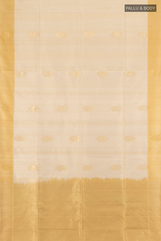 Flat view of Cream Soft Silk Saree with Zari Butta on the body and Silk Border. 