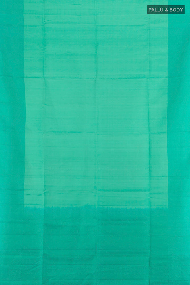 Flat view of Sky Blue Soft Silk Saree with Zari Butta on the body and Silk Border. 