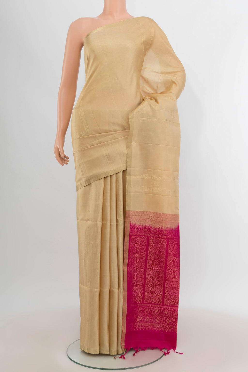 Dark Beige Soft Silk Saree with Zari Butta on the body and Zari Border.  displayed on a mannequin