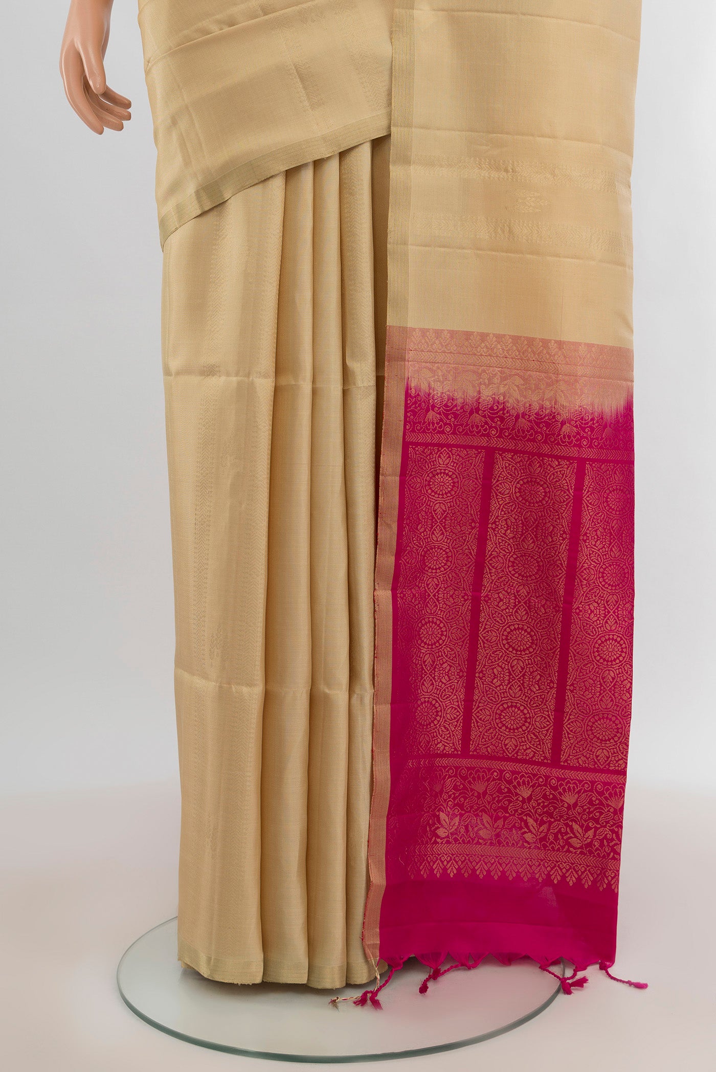 Pleats and pallu of Dark Beige Soft Silk Saree with Zari Butta on the body and Zari Border. 