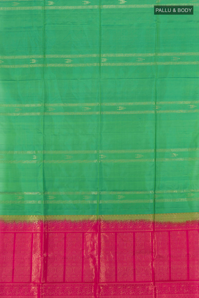 Flat view of Pure Silk Pure Zari Light Green Soft Saree with Zari Butta on the body and Silk Border. 