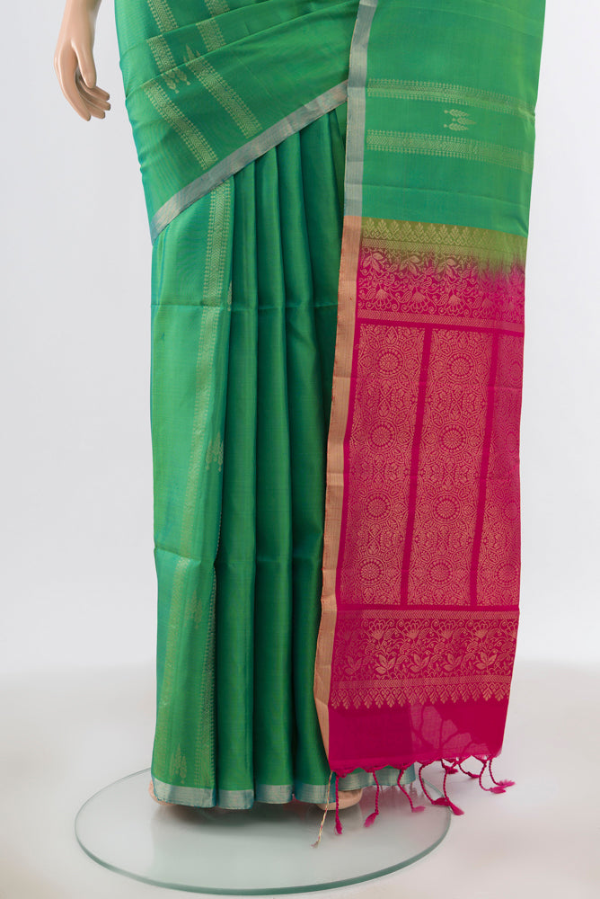 Pleats and pallu of Pure Silk Pure Zari Light Green Soft Saree with Zari Butta on the body and Silk Border. 