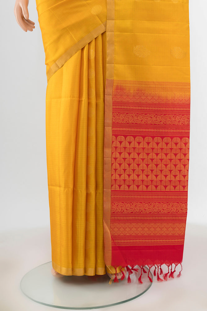 Pleats and pallu of Yellow Soft Silk Saree with Zari Butta on the body and Silk Border. 