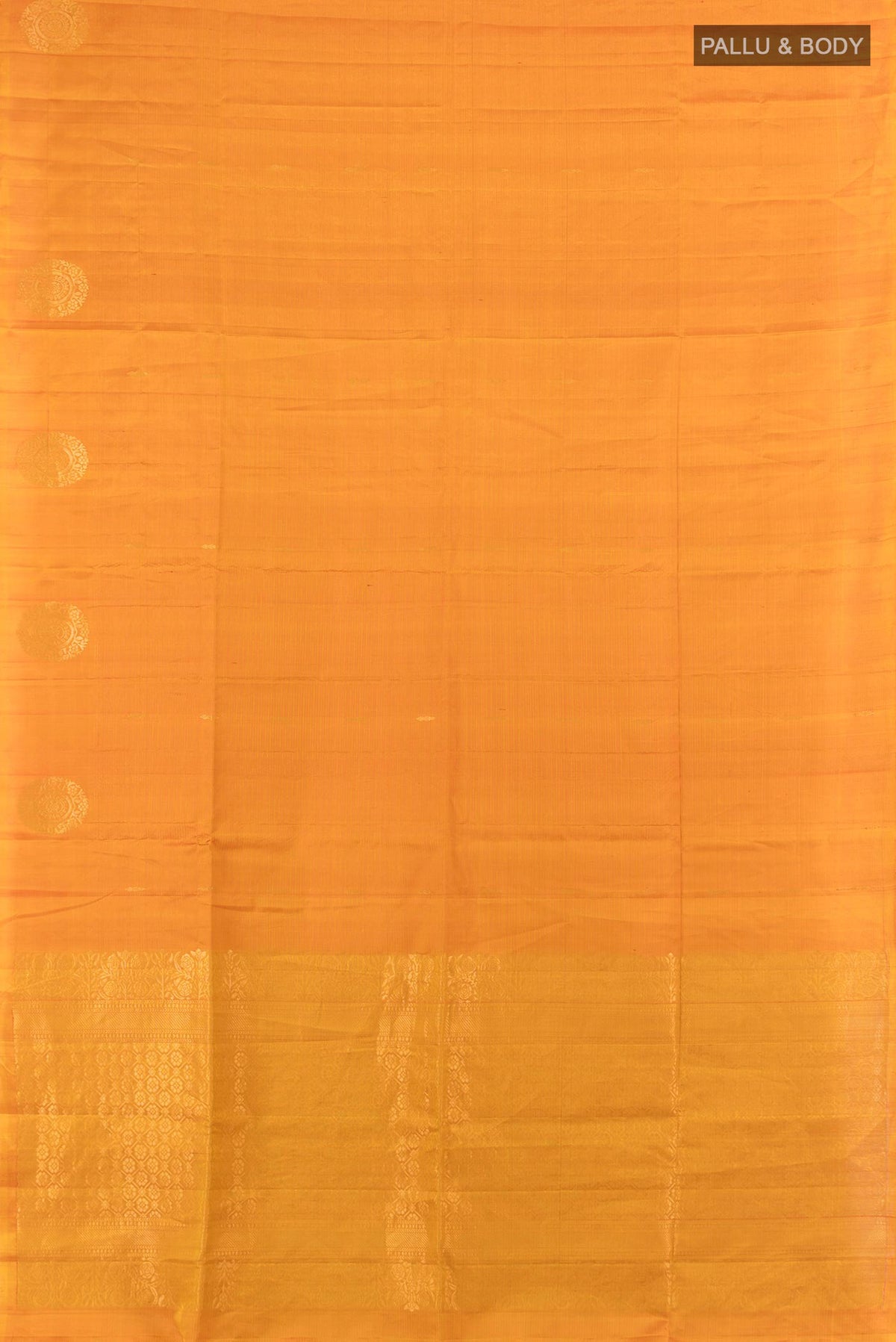 Flat view of Pure Silk Mustard Soft Saree with Zari Butta on the body and Without Border. 