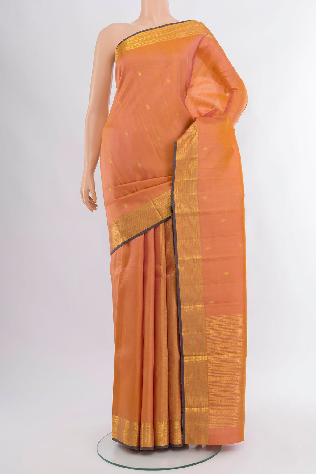 Peach Dual Tone Kanjivaram Silk Saree with Zari Butta on the body and Zari Border.  displayed on a mannequin