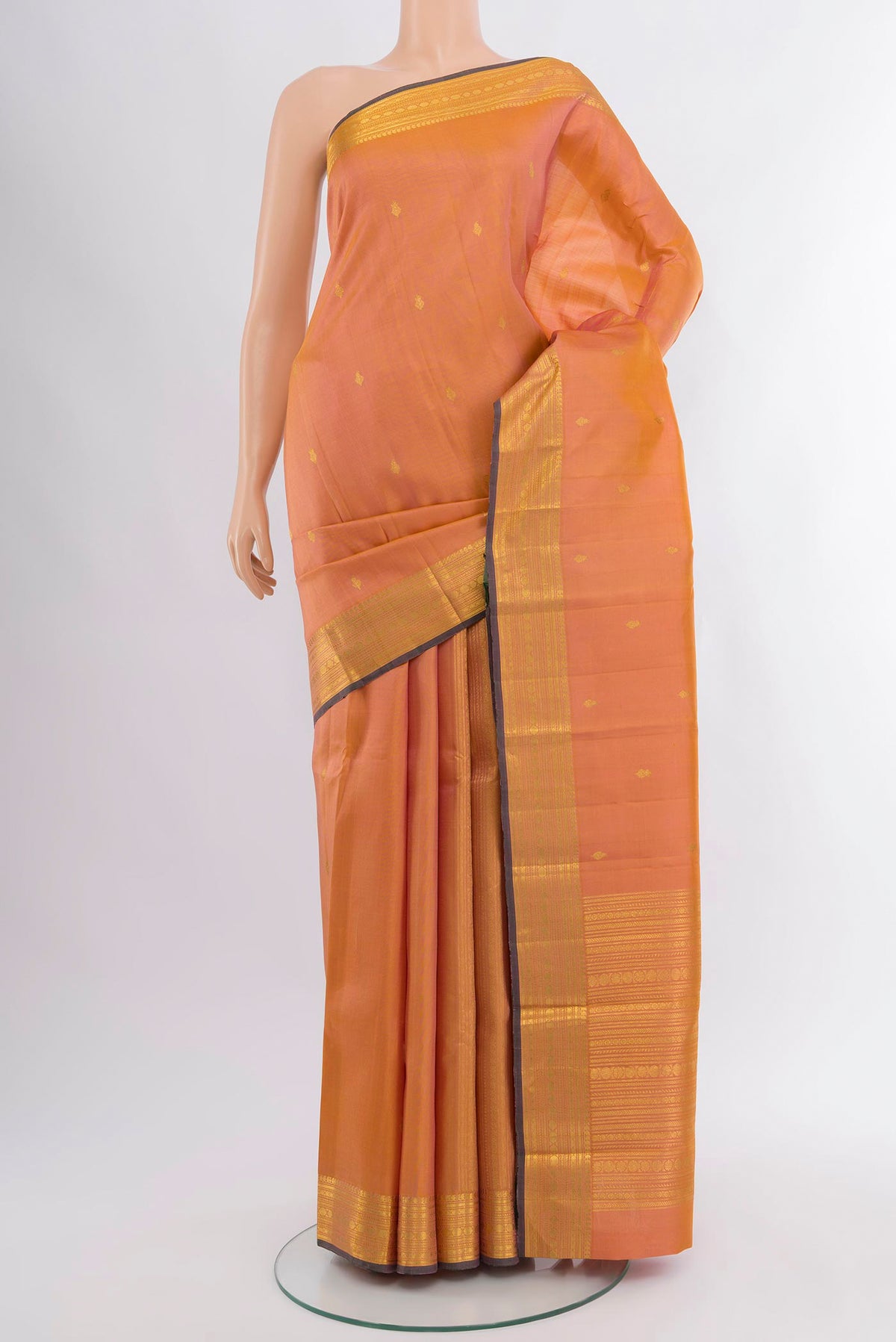 Peach Dual Tone Kanjivaram Silk Saree with Zari Butta on the body and Zari Border.  displayed on a mannequin