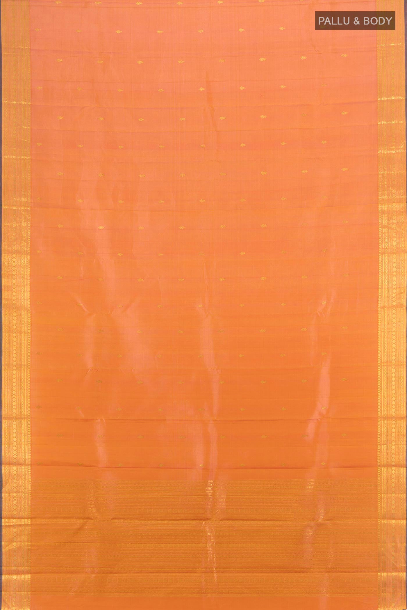 Flat view of Peach Dual Tone Kanjivaram Silk Saree with Zari Butta on the body and Zari Border. 