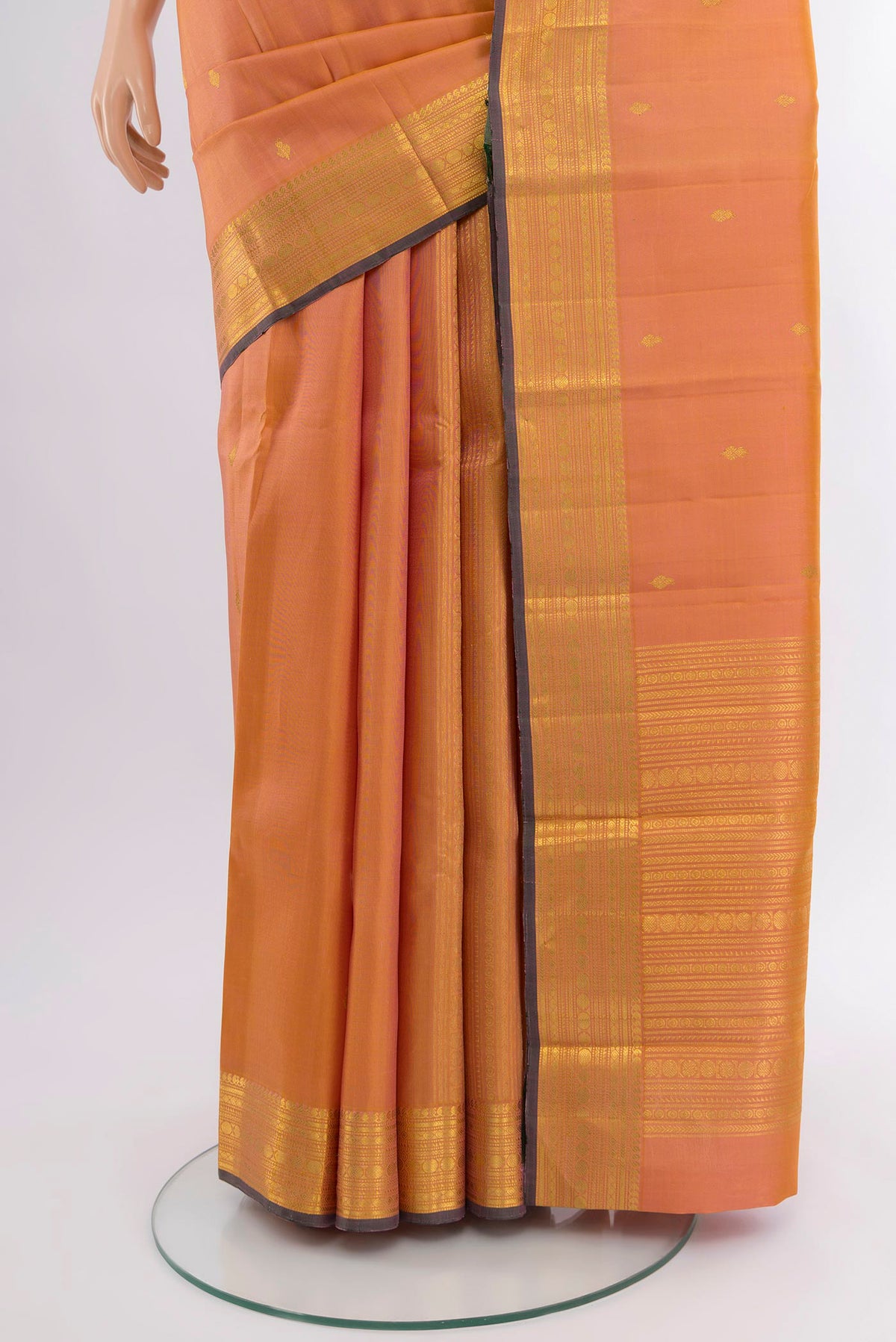 Pleats and pallu of Peach Dual Tone Kanjivaram Silk Saree with Zari Butta on the body and Zari Border. 