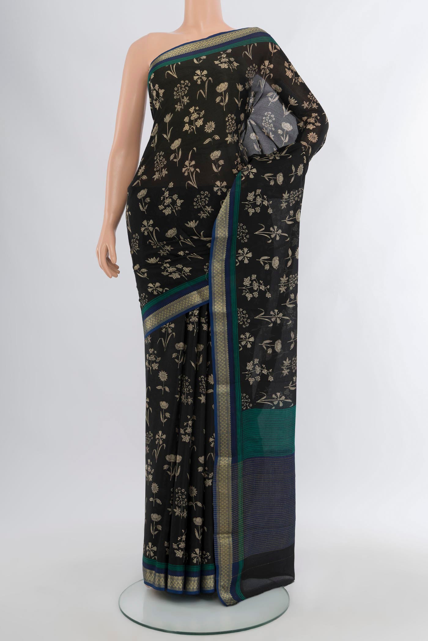 Black Mysore Crepe Saree with Floral Print on the body and Zari Border.  displayed on a mannequin