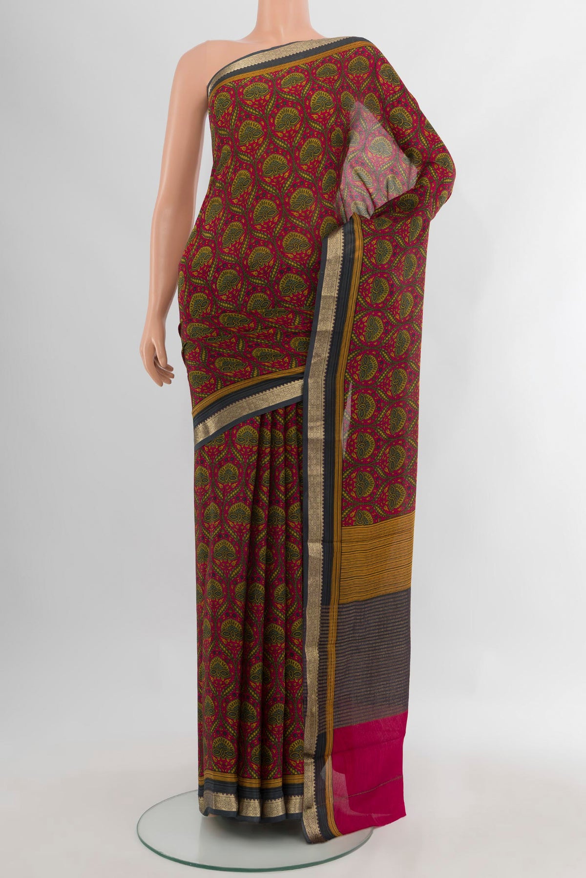 Dark Pink Crepe Saree with Floral Print on the body and Zari Border.  displayed on a mannequin