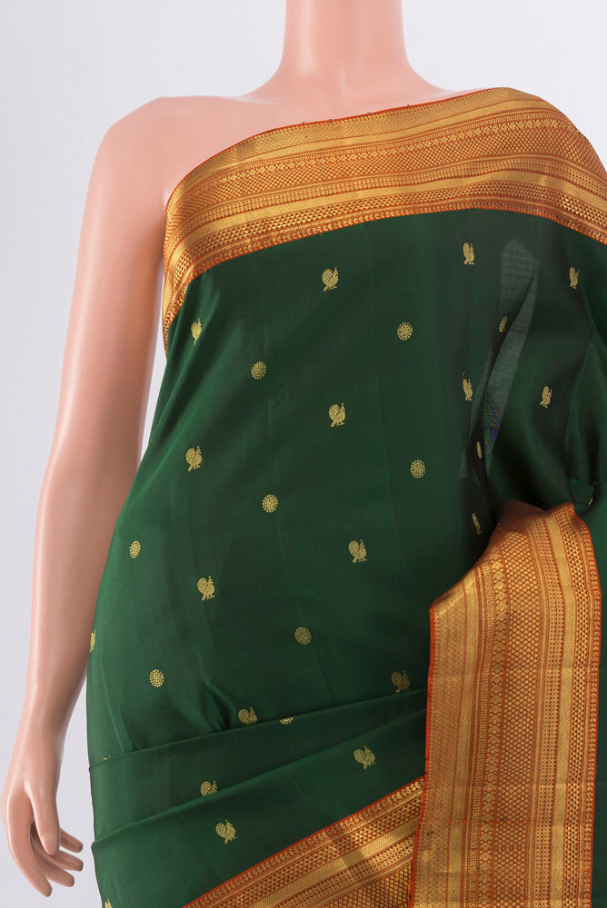 Border image of Bottle Green Kanchipuram Silk Saree with Zari Butta on the body and Silk Border. 