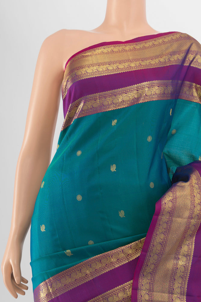 Border image of Peacock Blue Kanchipuram Silk Saree with Zari Butta on the body and Silk Border. 