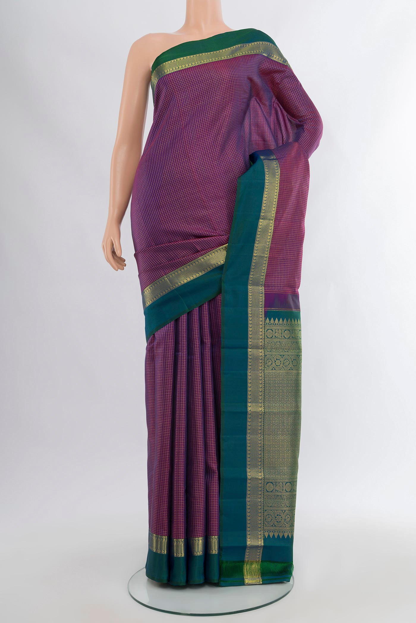 Purple Kanjivaram Silk Saree with Checked design on the body and Zari Border.  displayed on a mannequin