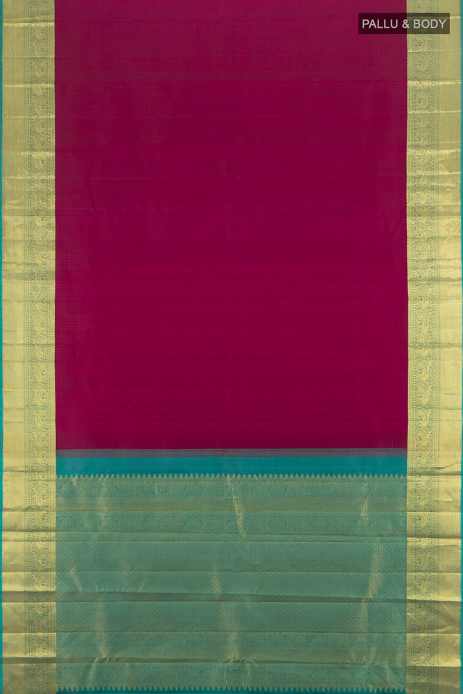 Flat view of Purple Kanjivaram Silk Saree with Zari Butta on the body and Silk Border. 