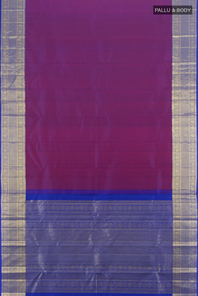 Flat view of Purple Kanjivaram Silk Saree with Zari Butta on the body and Silk Border. 