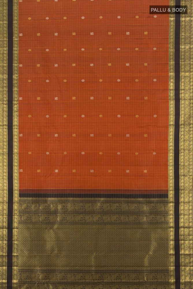 Flat view of Pure Silk Pure Zari Rust Kanjivaram Saree with Zari Butta on the body and Silk Border. 