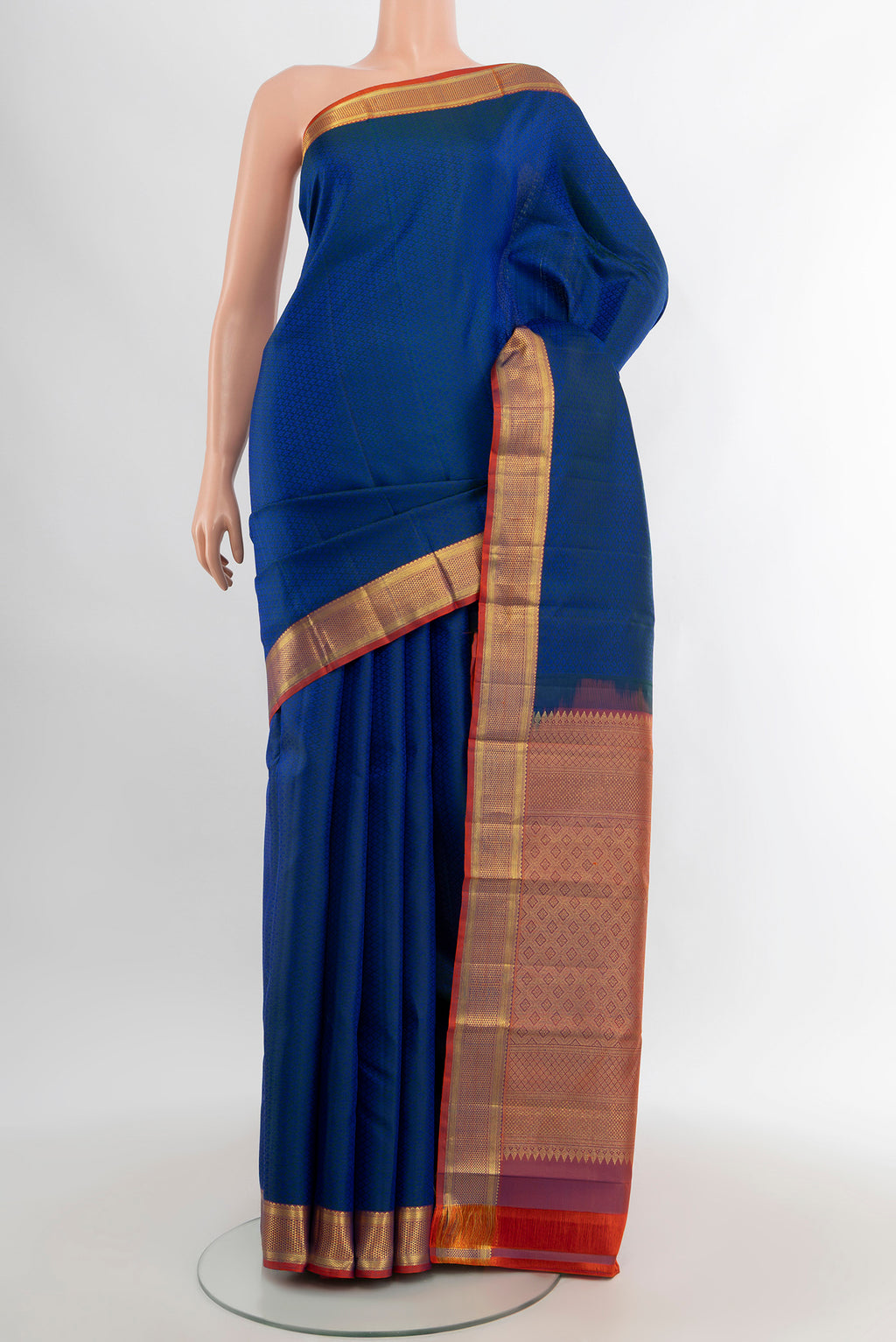 Royal Blue Kanjivaram Silk Saree with Jacquard design on the body and Zari Border.  displayed on a mannequin