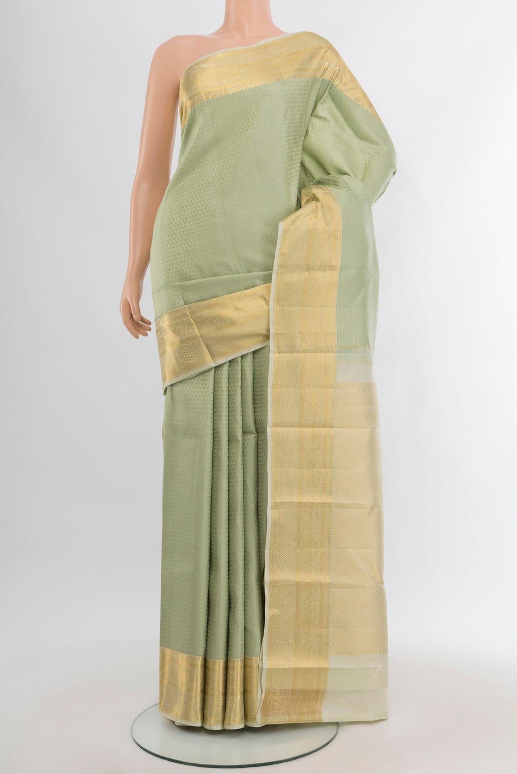Light Green Kanjivaram Silk Saree with Jacquard design on the body and Zari Border.  displayed on a mannequin
