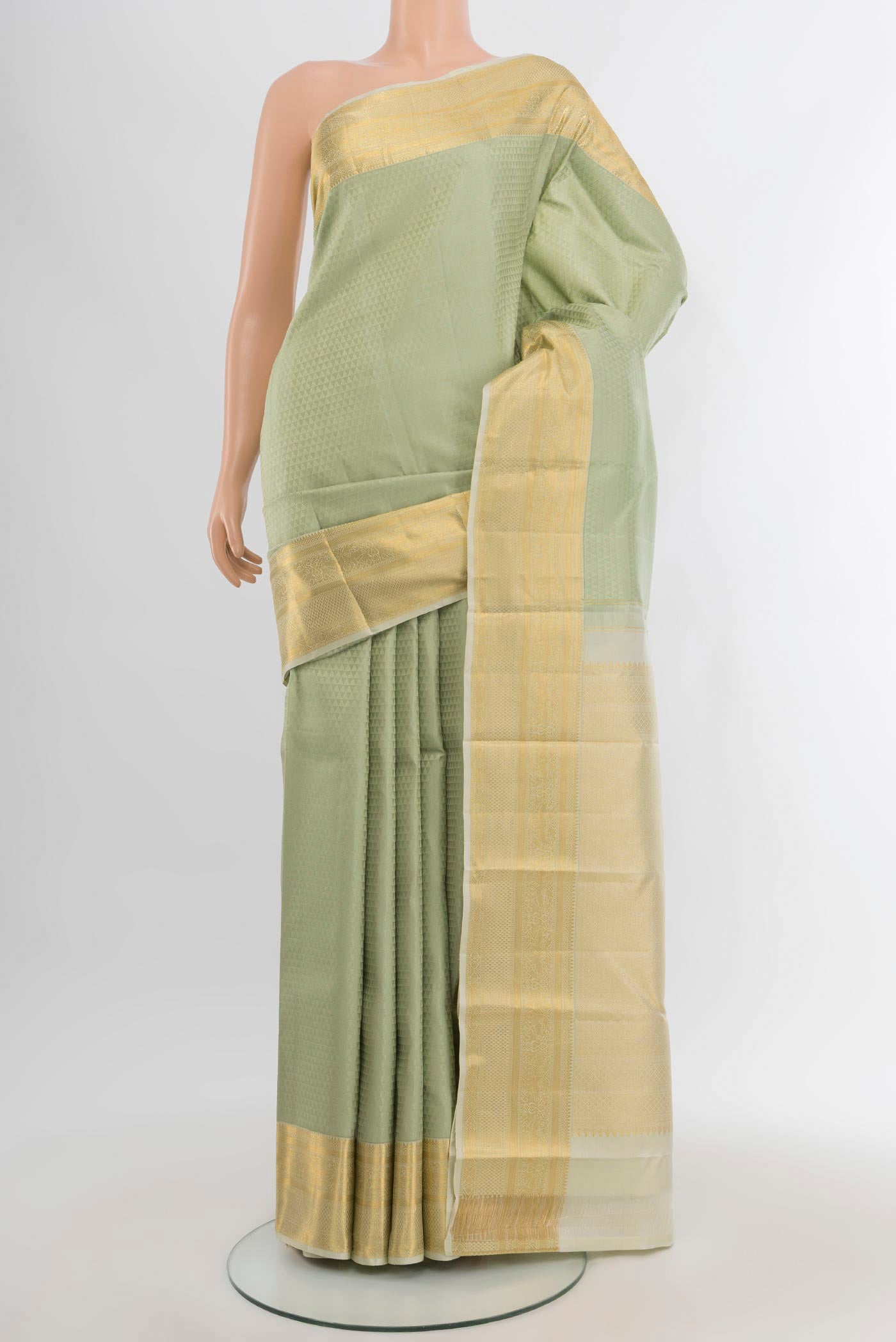Light Green Kanjivaram Silk Saree with Jacquard design on the body and Zari Border.  displayed on a mannequin