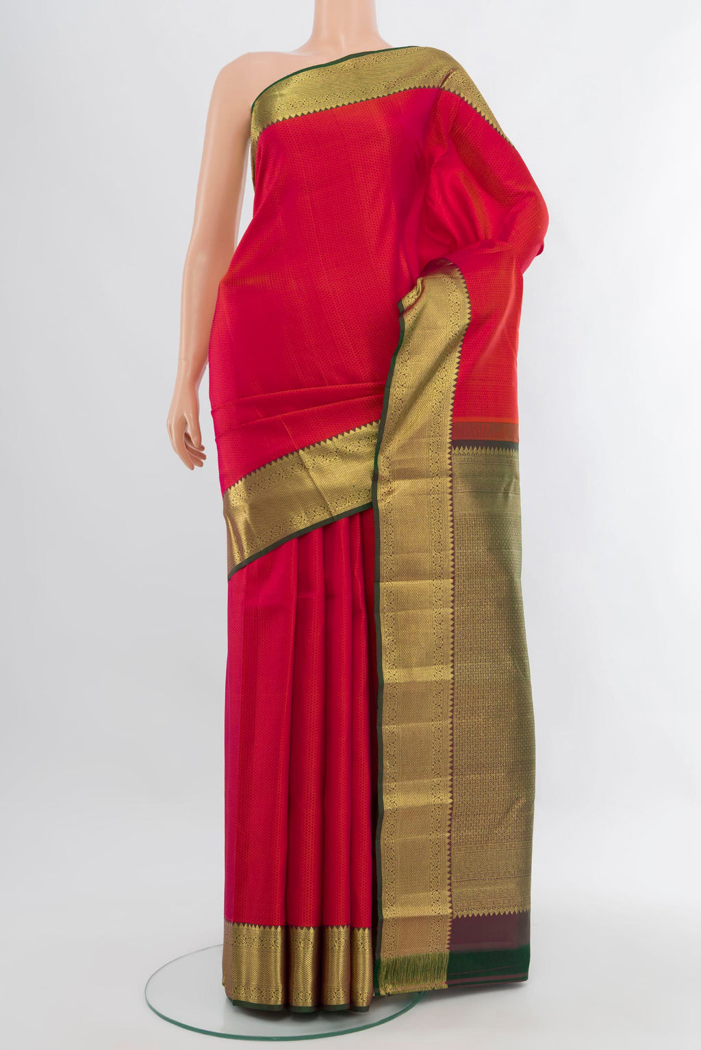 Pink Kanjivaram Silk Saree with Jacquard design on the body and Zari Border.  displayed on a mannequin