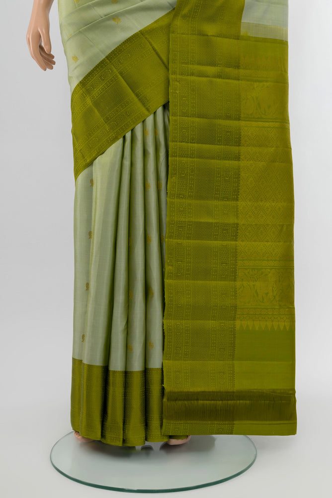 Pleats and pallu of Light Green Kanchipuram Silk Saree with Zari Butta on the body and Silk Border. 