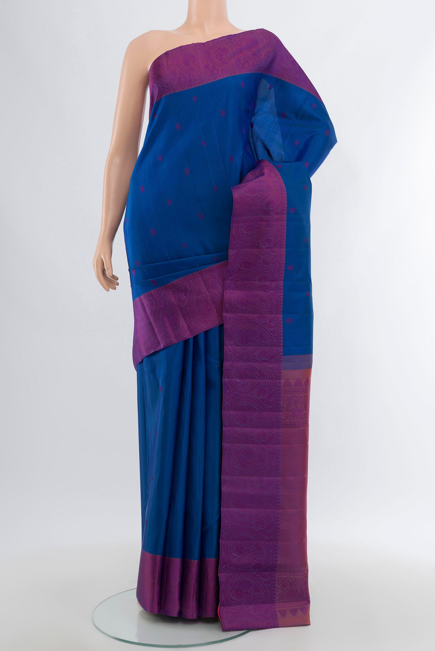 Blue Kanchipuram Silk Saree with Thread Butta on the body and Thread Border.  displayed on a mannequin