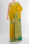 Yellow Kanjivaram Silk Saree with Checked design on the body and Zari Border.  displayed on a mannequin