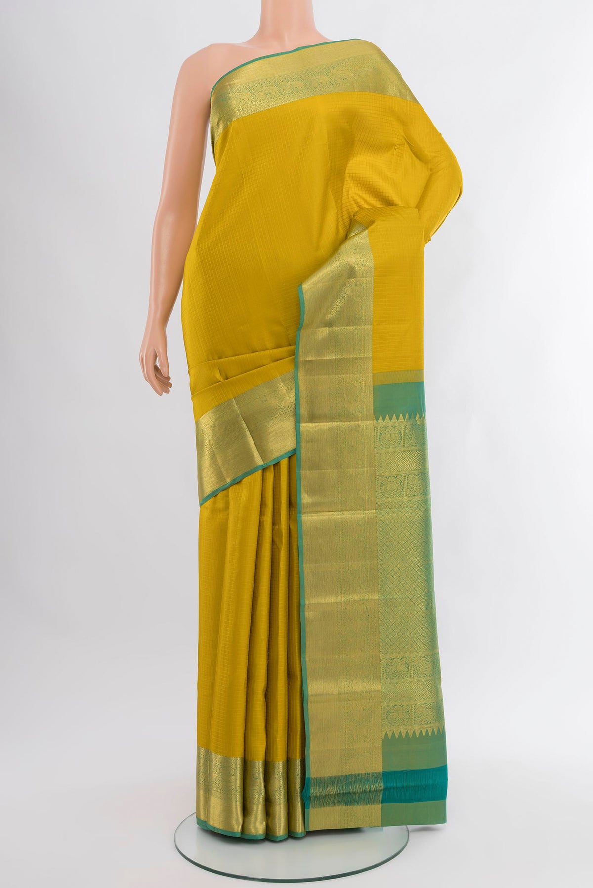 Yellow Kanjivaram Silk Saree with Checked design on the body and Zari Border.  displayed on a mannequin